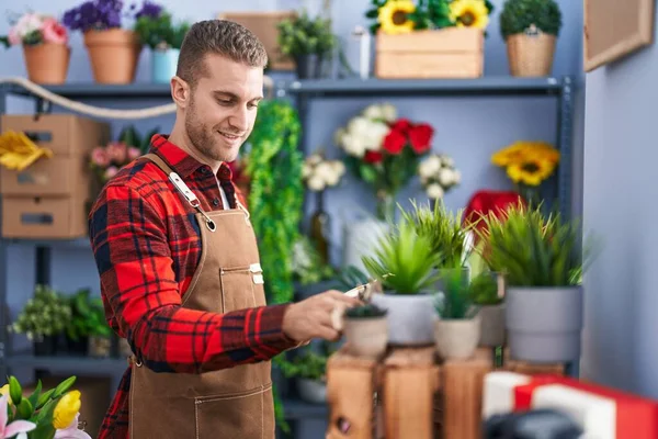 Young Caucasian Man Florist Reading Notebook Holding Plant Flower Shop — Stockfoto