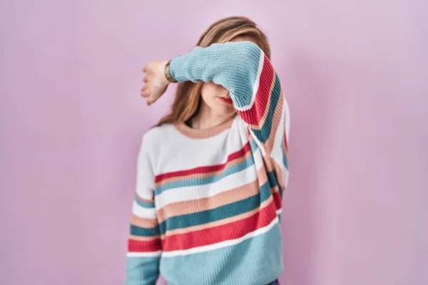 Young Blonde Woman Standing Pink Background Covering Eyes Arm Looking — Stockfoto
