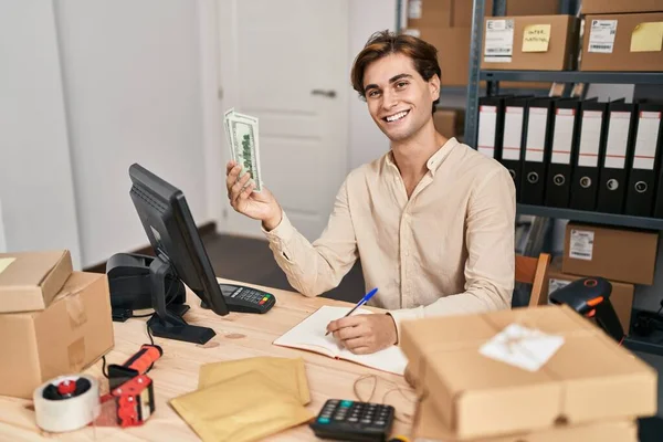 Young Caucasian Man Ecommerce Business Worker Holding Dollars Writing Notebook —  Fotos de Stock
