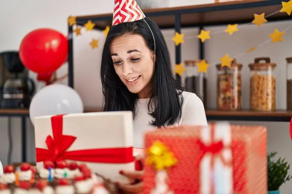 Young Caucasian Woman Opening Gift Box Celebrating Birthday Home — Stok fotoğraf
