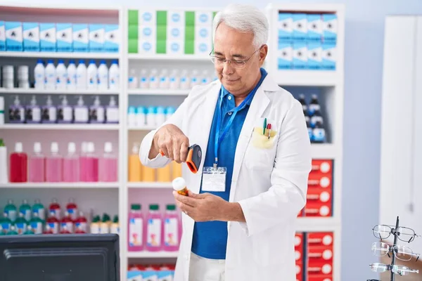 Middle Age Grey Haired Man Pharmacist Scanning Pills Bottle Pharmacy — Stock Photo, Image