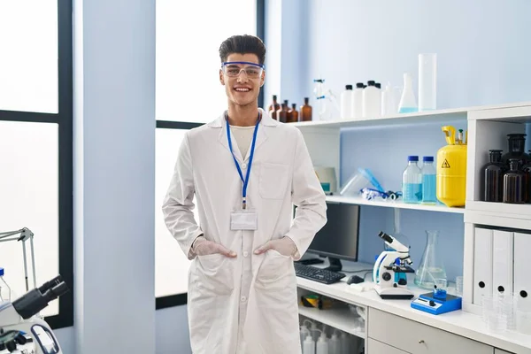 Young Hispanic Man Wearing Scientist Uniform Standing Laboratory — ストック写真