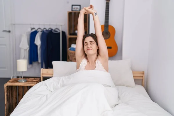 Young Woman Waking Stretching Arms Bedroom — Foto de Stock