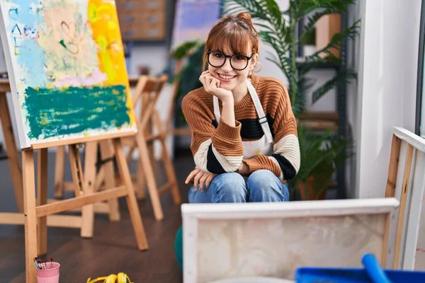 Young Woman Artist Smiling Confident Sitting Chair Art Studio — Zdjęcie stockowe