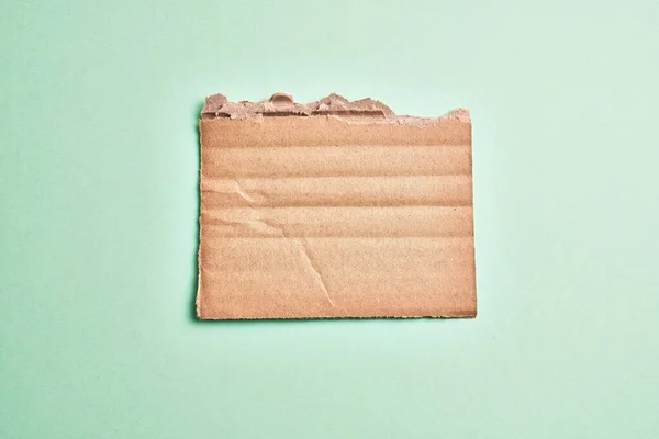 One Ripped Piece Cardboard Material Isolated Green Background — 스톡 사진