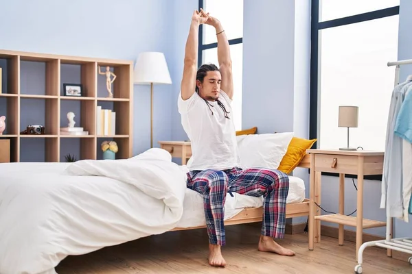 Young Man Stretching Arms Sitting Bed Bedroom — 图库照片