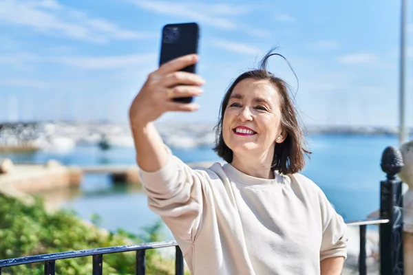 Middle Age Woman Smiling Confident Making Selfie Smartphone Seaside — Stock Photo, Image