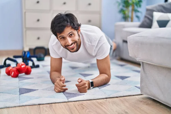 Young Hispanic Man Smiling Confident Training Abs Exercise Home — Foto Stock