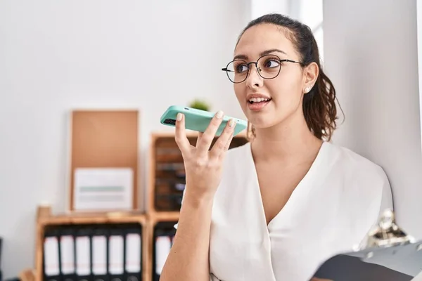 Young Beautiful Hispanic Woman Business Worker Talking Smartphone Holding Clipboard — Stock Photo, Image