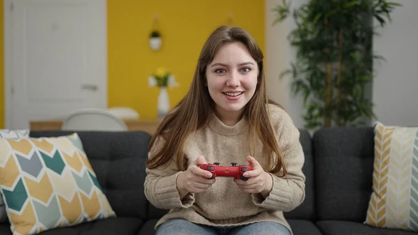 Young Blonde Woman Playing Video Game Sitting Sofa Home — Stock Fotó