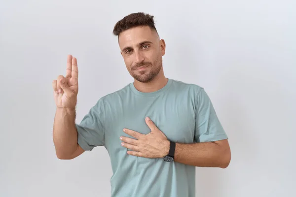 Hispanic Man Beard Standing White Background Smiling Swearing Hand Chest — Photo
