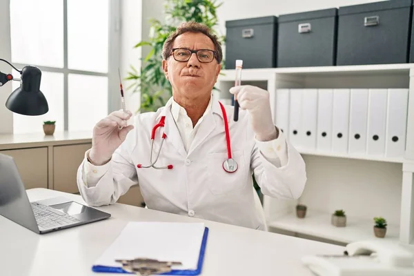 Senior Doctor Man Holding Syringe Blood Sample Puffing Cheeks Funny — Stock Photo, Image