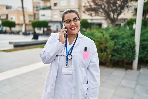 Young Beautiful Size Woman Doctor Smiling Confident Talking Smartphone Park — Stok fotoğraf