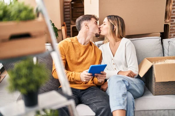 Young Man Woman Couple Using Touchpad Sitting Sofa New Home — Stockfoto