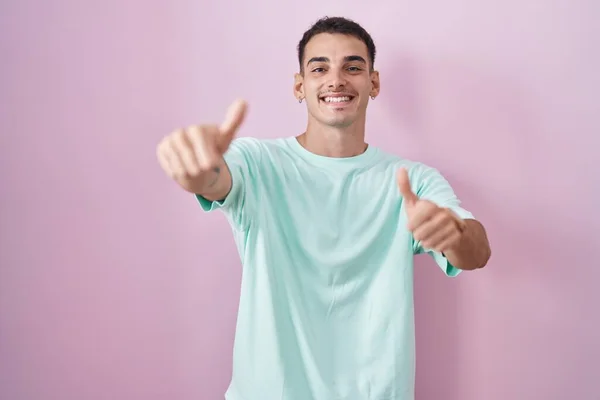 Handsome Hispanic Man Standing Pink Background Approving Doing Positive Gesture — Stock Photo, Image