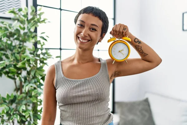 Young Hispanic Woman Smiling Confident Holding Alarm Clock Home — Stock Photo, Image