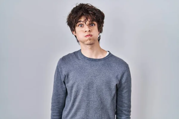 Young Man Standing Isolated Background Puffing Cheeks Funny Face Mouth — 스톡 사진