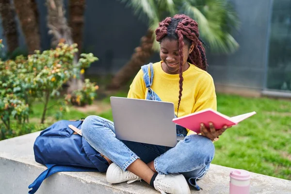 African American Woman Student Using Laptop Reading Book Campus Park — Stockfoto