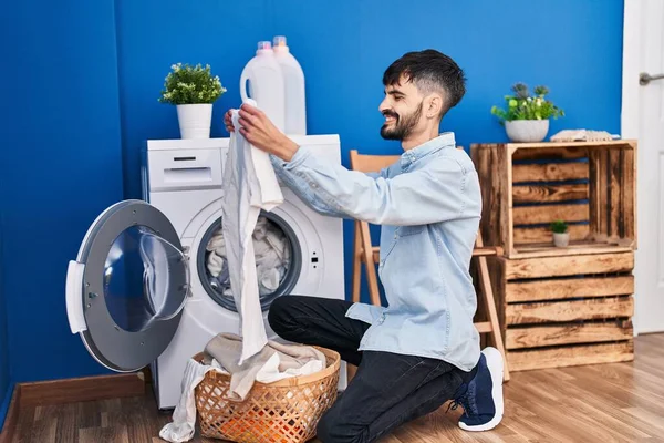 Young Hispanic Man Holding White Shirt Washing Clothes Laundry Room — 图库照片