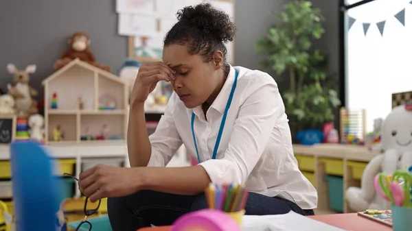 African American Woman Teacher Overworked Collecting Toys Kindergarten — Stock Fotó