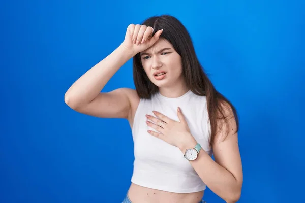 Young Caucasian Woman Standing Blue Background Touching Forehead Illness Fever — Stockfoto