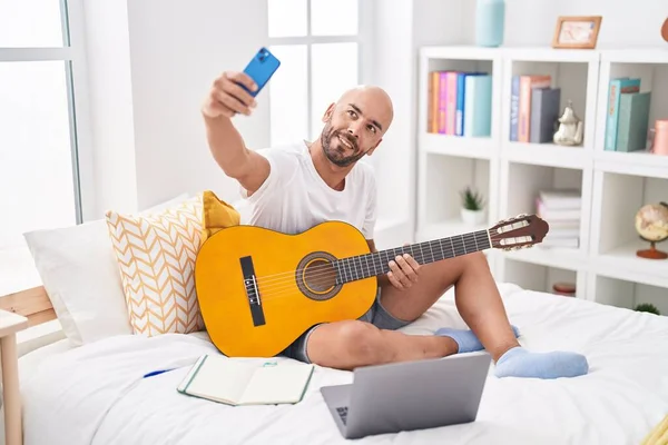 Young Bald Man Playing Classical Guitar Make Selfie Smartphone Bedroom — Stockfoto