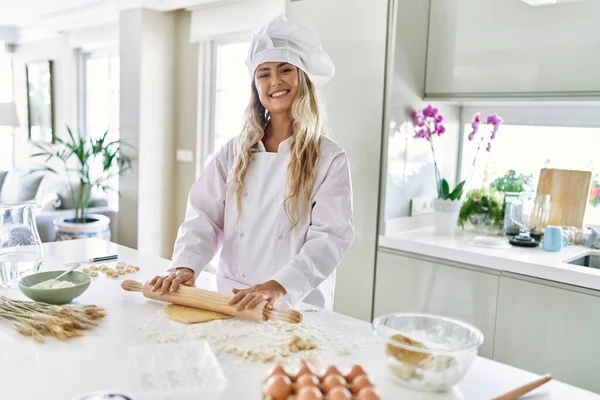 Young Woman Wearing Cook Uniform Kneading Pasta Dough Kitchen — Stockfoto