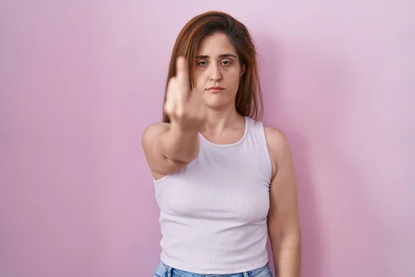 Brunette Woman Standing Pink Background Showing Middle Finger Impolite Rude — Photo