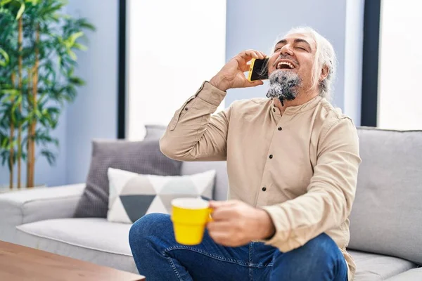 Middle Age Grey Haired Man Talking Smartphone Drinking Coffee Home — Foto Stock