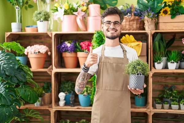 Young Hispanic Man Tattoos Working Florist Shop Holding Plant Smiling — Stock Photo, Image