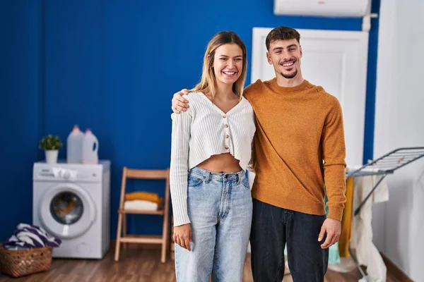 Young Man Woman Couple Smiling Confident Hugging Each Other Laundry — Stock fotografie
