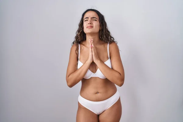 Young Hispanic Woman Wearing White Lingerie Begging Praying Hands Together — Stock Photo, Image