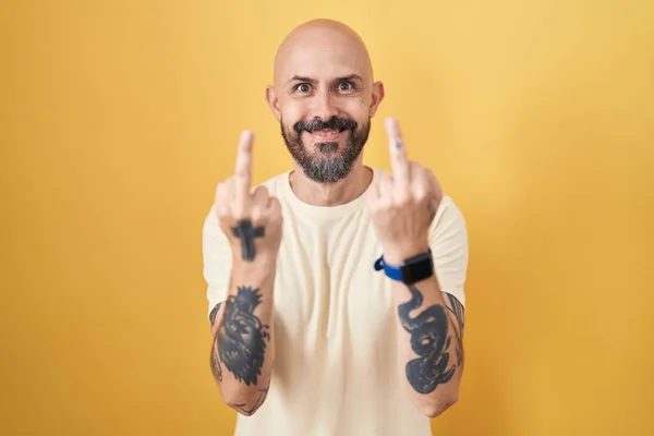Hispanic Man Tattoos Standing Yellow Background Showing Middle Finger Doing — Stok Foto