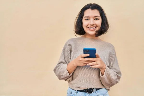 Young Woman Smiling Confident Using Smartphone Yellow Background — Stock Photo, Image