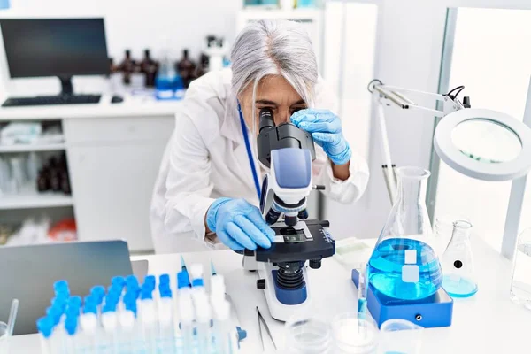 Middle Age Grey Haired Woman Wearing Scientist Uniform Using Microscope — Stock Photo, Image