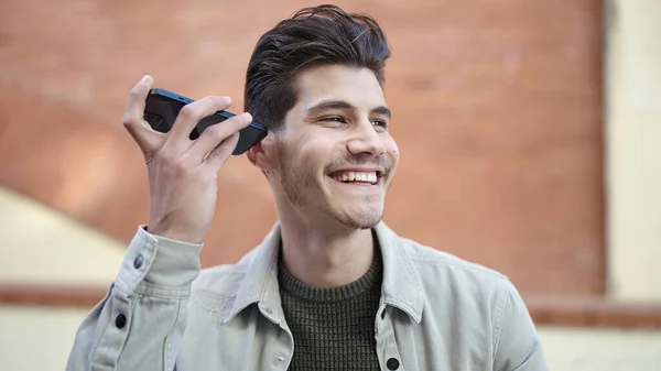 Young Hispanic Man Smiling Confident Listening Audio Message Smartphone Street — Stock Photo, Image