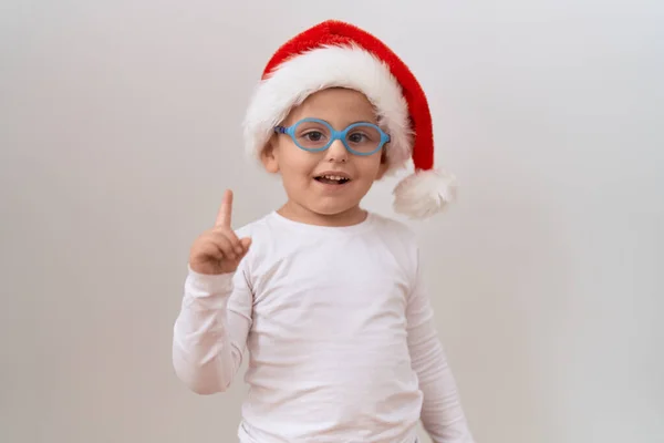 Little Hispanic Boy Wearing Glasses Christmas Hat Smiling Happy Pointing — Stock Photo, Image