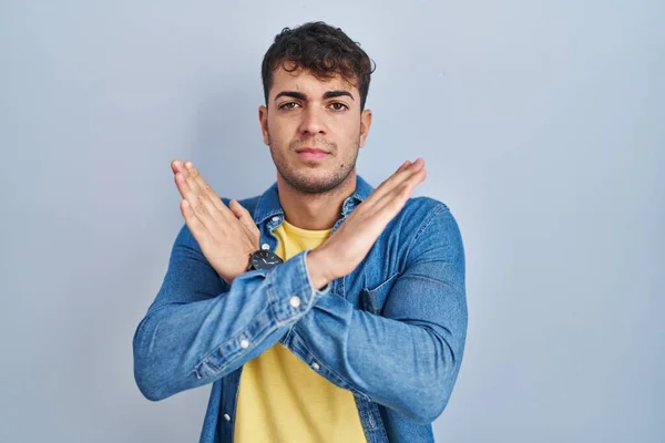 Young Hispanic Man Standing Blue Background Rejection Expression Crossing Arms — Fotografia de Stock