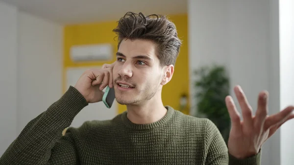 Young Hispanic Man Talking Smartphone Unhappy Expression Home — Stock Fotó