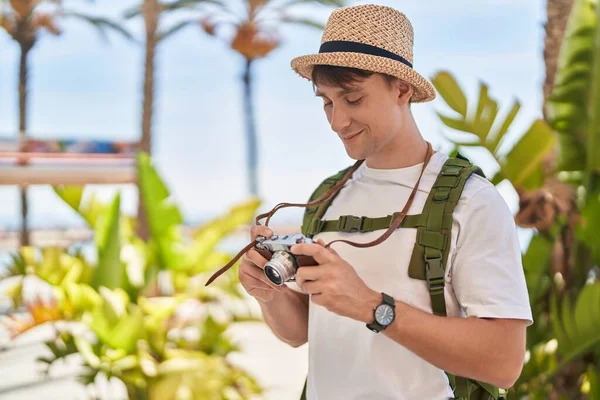 Young Caucasian Man Tourist Smiling Confident Holding Vintage Camera Park — Stockfoto