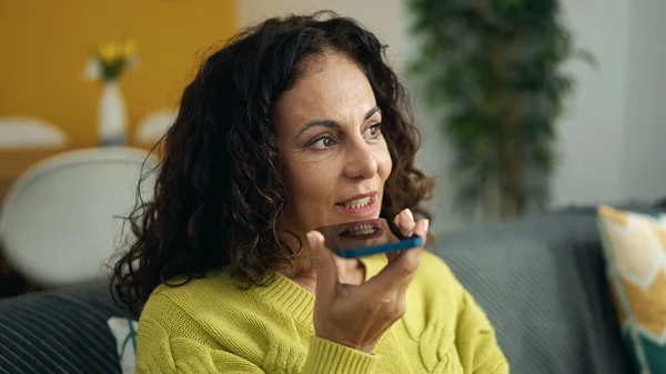 Middle Age Hispanic Woman Sending Voice Message Smartphone Sitting Sofa — 图库照片