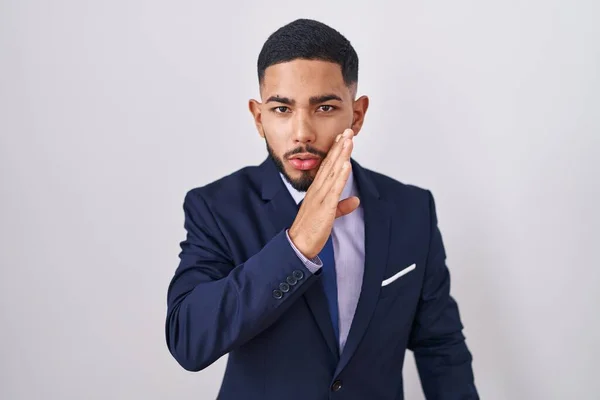 Young Hispanic Man Wearing Business Suit Tie Hand Mouth Telling — Fotografia de Stock