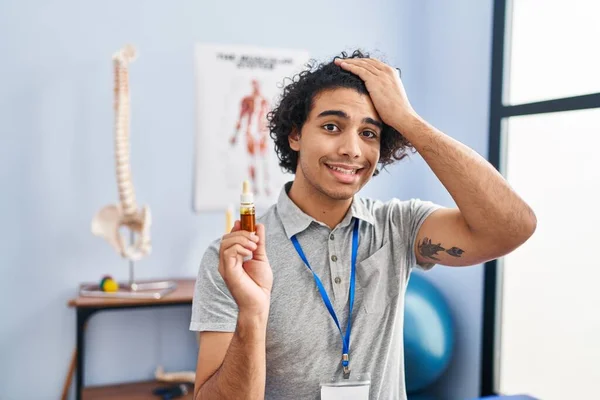 Hispanic Man Curly Hair Holding Cbd Oil Stressed Frustrated Hand — Stock Photo, Image