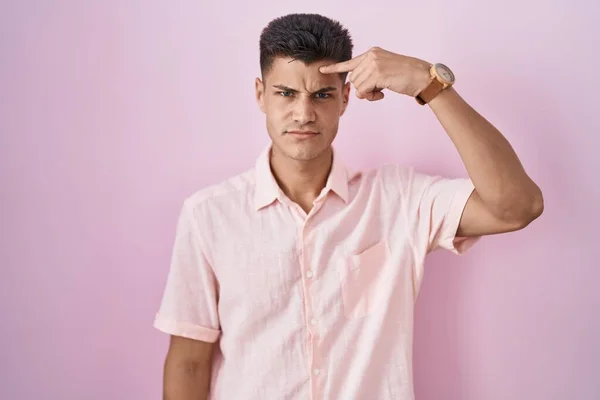Young Hispanic Man Standing Pink Background Pointing Unhappy Pimple Forehead — Photo
