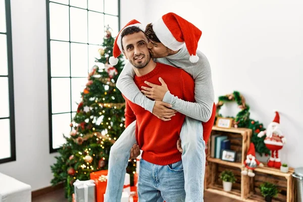 Two Hispanic Men Couple Holding Back Standing Christmas Tree Home — Stock Photo, Image