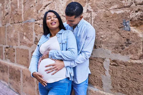 Young Latin Couple Expecting Baby Touching Belly Street — Stockfoto