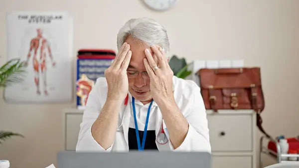 Middle Age Man Grey Hair Doctor Stressed Working Clinic — Stock Photo, Image