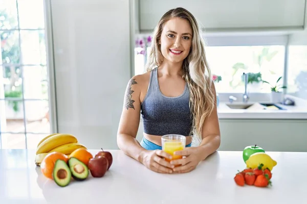 Young Woman Smiling Confident Holding Orange Juice Kitchen — Stockfoto