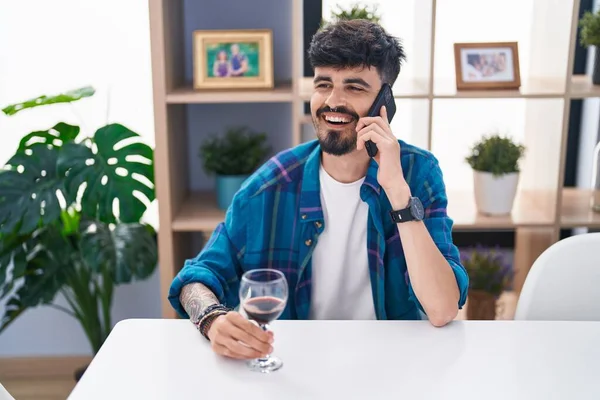 Young Hispanic Man Talking Smartphone Drinking Wine Home — Photo