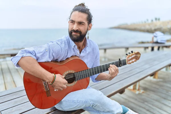 Young Hispanic Man Musician Playing Classical Guitar Sitting Bench Seaside — Stock Fotó